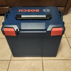 Bosch Plastic tool box has a deep body for storing tools, a lid that lifts open for loading and unloading, and handles for carrying between locations.