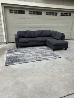 Beautiful Grey Two Peice Sectional Couch (Delivery Available)