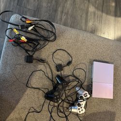 PlayStation 2 With Two Controllers And Wires 