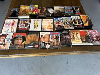 Assorted DVD And VHS Tapes