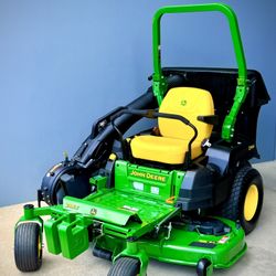 Brand new John Deere Z515E ZTrak 54-in 24 -HP V-twin Gas Zero-turn Riding Lawn Mower comes with extra bagger and flow blower.  Production date 2025 