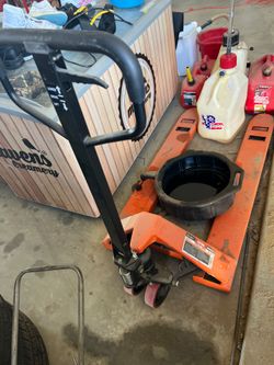 Pallet jack and ice cream freezer.