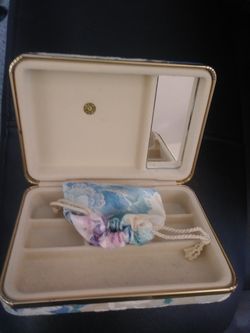 jewlery box with a little jewlery bag and mirror