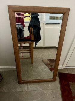 Mirror in wood frame