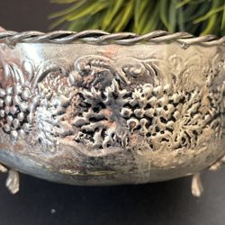 Beautifully crafted  bowl with intricate grapevine design. Perfect for home decor.