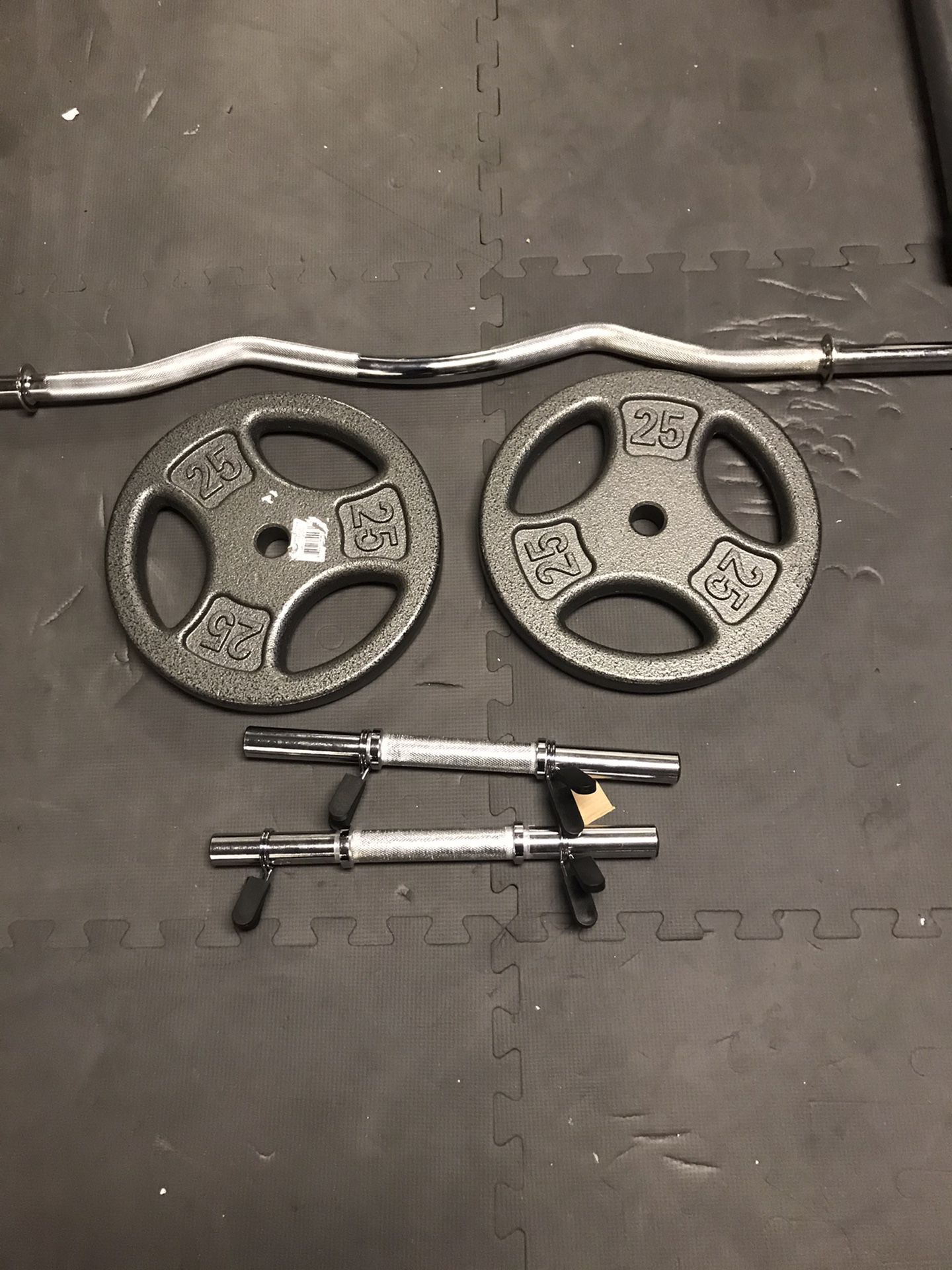 New 2x 25 lb 1 inch plates with dumbbell handles and curl bar