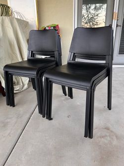 6 - new high density black Stackable chairs. ( plastic metal legs ).