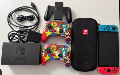 Nintendo Switch Bundle – 2 Mario Controllers + Case + Dock – Great Condition