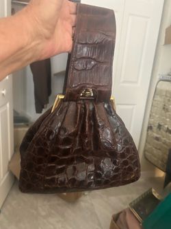 Old  alligator purse between the 20 to the 40s, I believe b