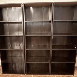 3 Brown Wood Bookcases