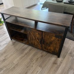 Brown and black Industrial TV stand In Good Used Condition