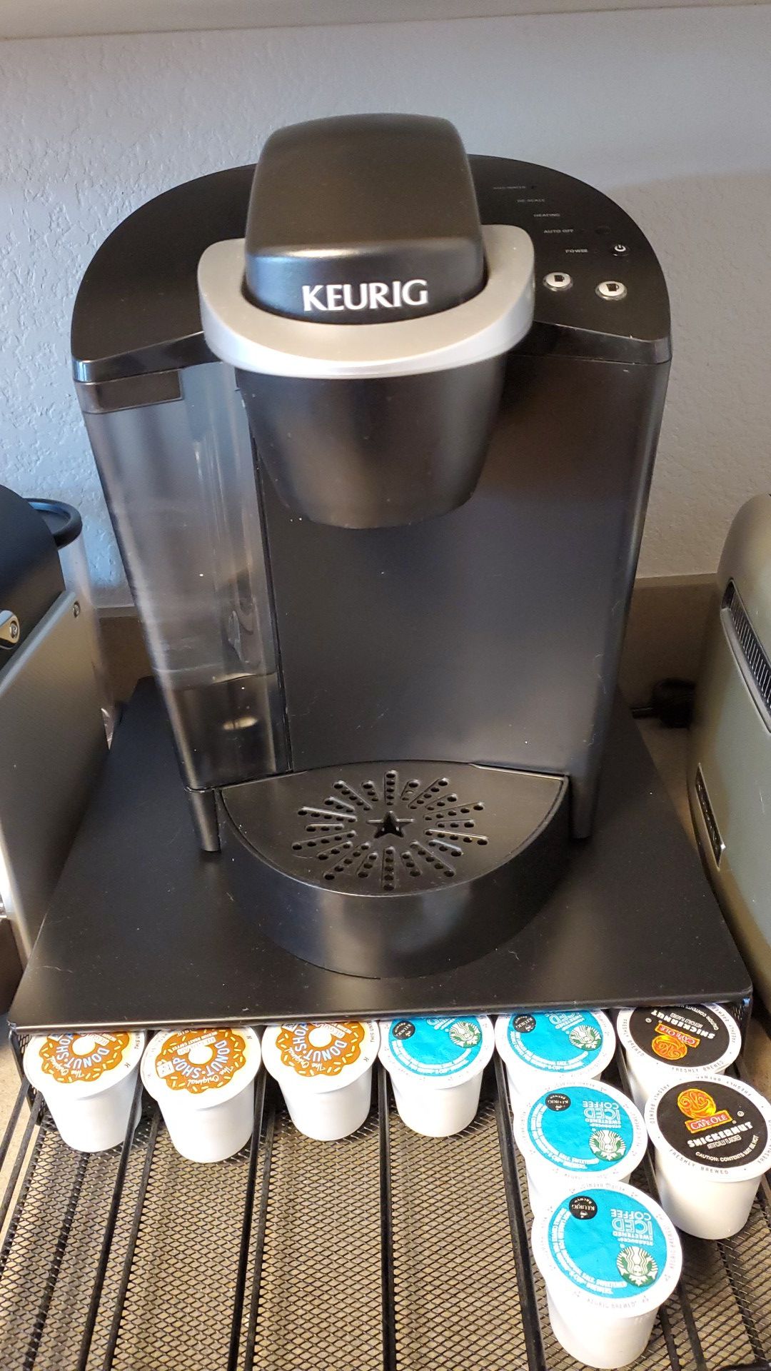 Older Keurig with stands for cup holders