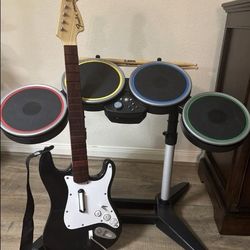 Xbox 360 wireless guitar drums with stand new replacement sticks foot pedal and microphone.