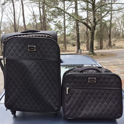 Vera bradley matching set of suitcases.