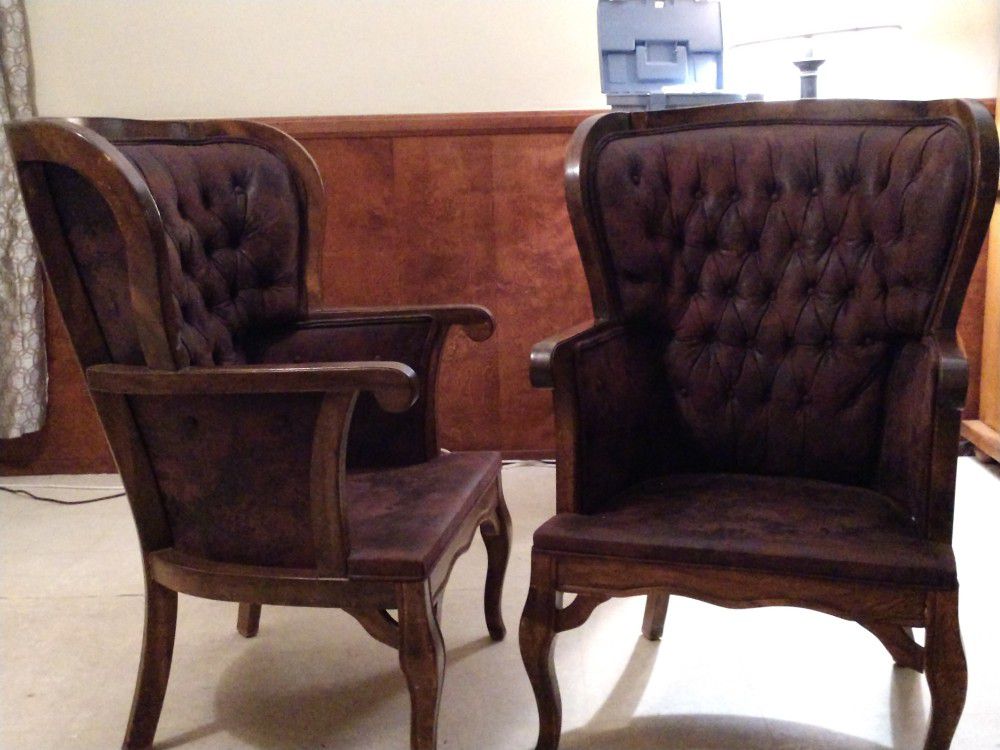 Antique, high-back arm chairs