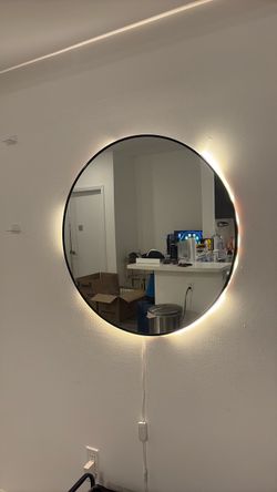 Wall mirror with light