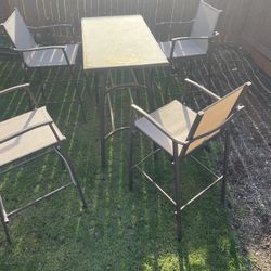 Table and 4 chairs 