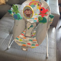 Baby bouncer with soothing vibration option
