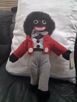  black raggedy Ann like doll.