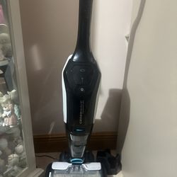 Almost new Bissell CrossWave Cordless Vacuum/Mop and liquid cartridges