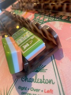 Mahjong racks with magnetic pushers