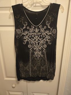 FREE.    Ladies Sleeveless Tops