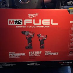 Brand new, impact and hammer  drill with battery and chargers and bag 
