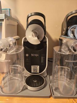 Ninja slushie machine, model number fs300 48 oz model with two vessel containers. Only used once