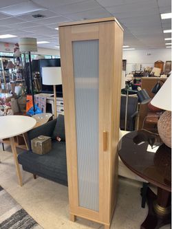 Aneboda wardrobe in a light wood finish with a frosted, textured panel.