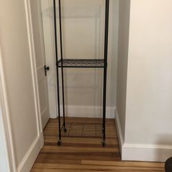 Metal Clothing rack , or Storage rack on wheels, $40