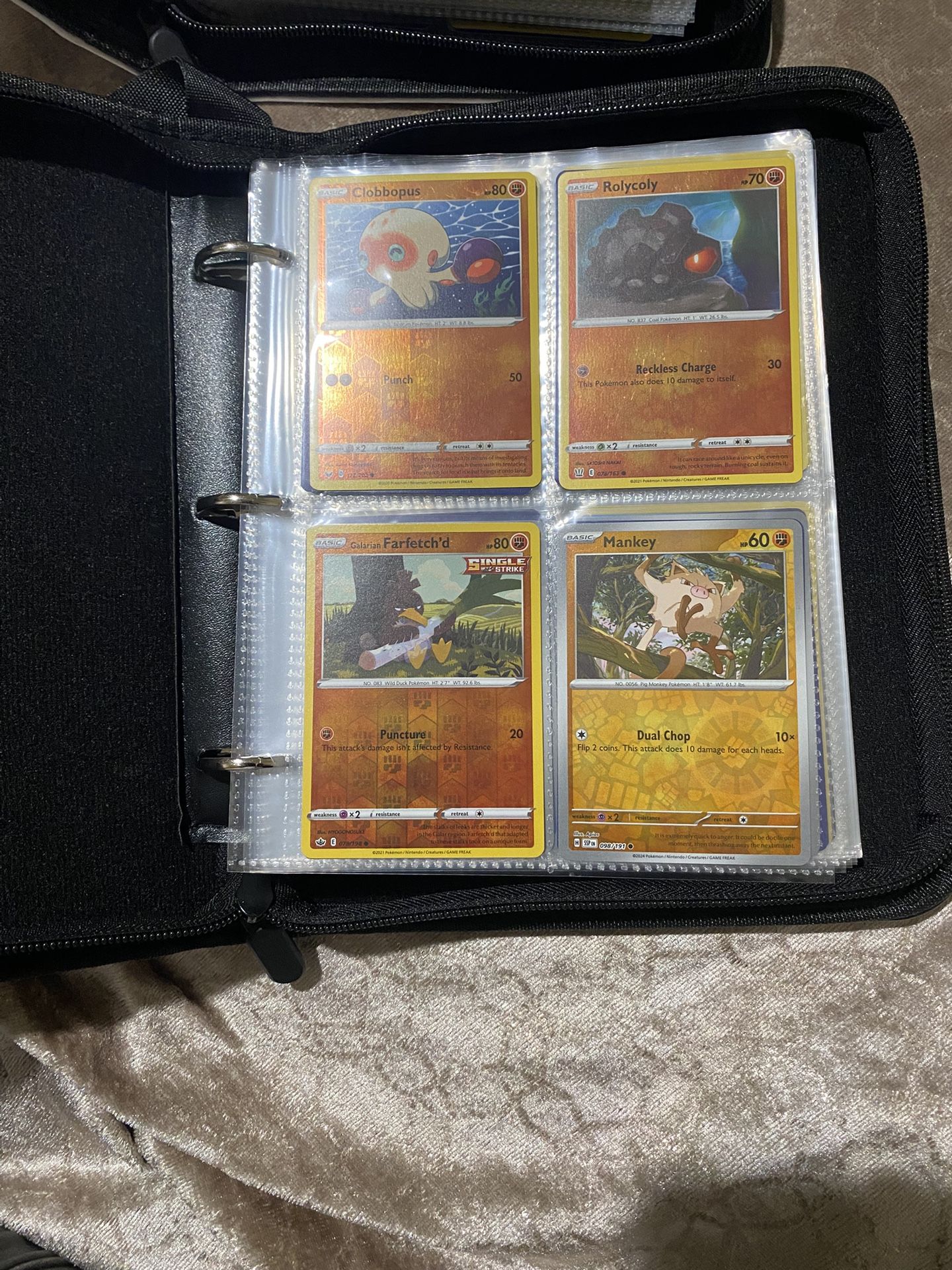 A Book And A Half Full Of Holographic Pokémon Cards