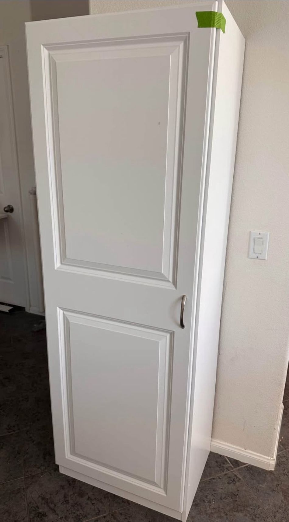 Tall white storage cabinet