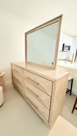 Dresser with mirror and two nightstands.