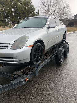 03 g35 black rims and tires /parts