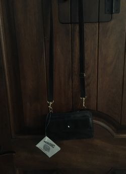 Black extendable bag from compartment to backpack