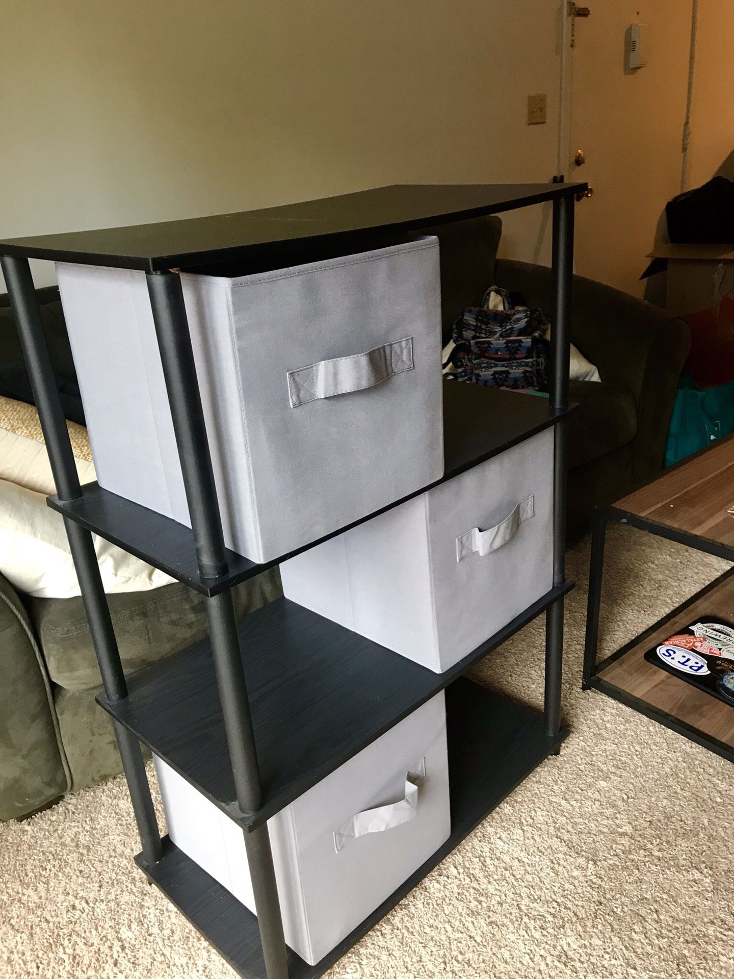 Shelving unit with collapsible storage bins