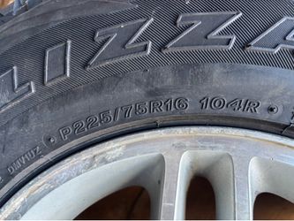 Set of 16” Jeep rims and Bridgestone tires