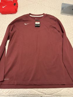 Men’s Nike long sleeve T-shirt size large and new with tags burgundy colour