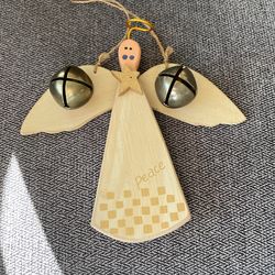 !Wooden angel can be used on the tree or hung somewhere else very cute