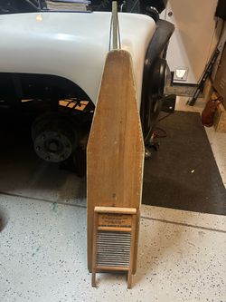 Antique ironing board and washboard