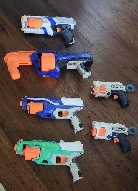 4 Nerf Guns And 2 X-shot