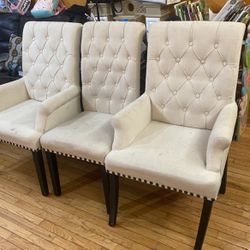 Two Tufted arm Chairs And One Regular Chair Dining Room