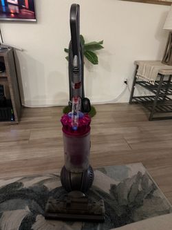 The Dyson DV41 is a corded, bagless upright vacuum cleaner featuring Dyson Ball technology and Radial Root Cyclone technology for high suction power.