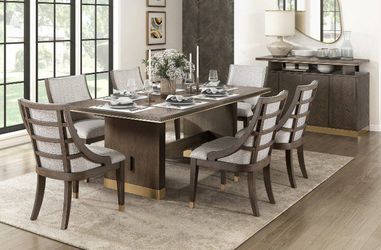 Modern Design dining set features brown & gold finish w/trestle base