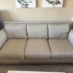 Beige 3 cushion sofa