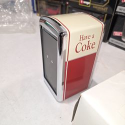 The Coca Cola Company napkin dispenser
