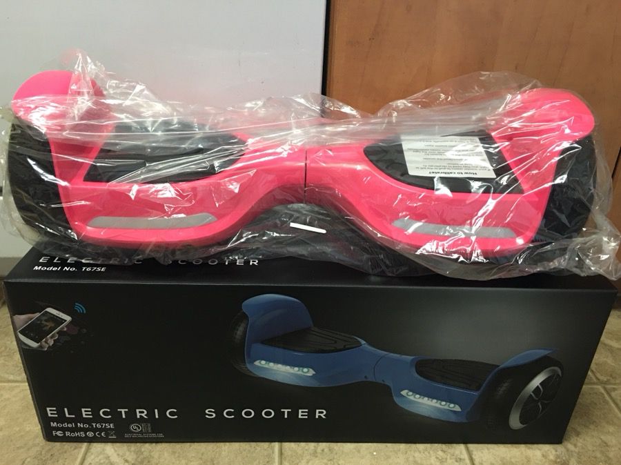 Brand new pink hoverboard has Bluetooth speaker