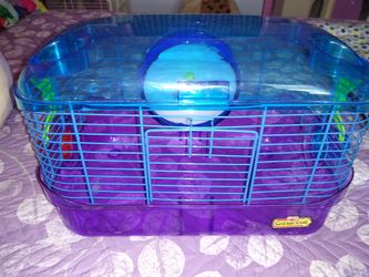 Hamster cage comes with water bottle and a will and good condition