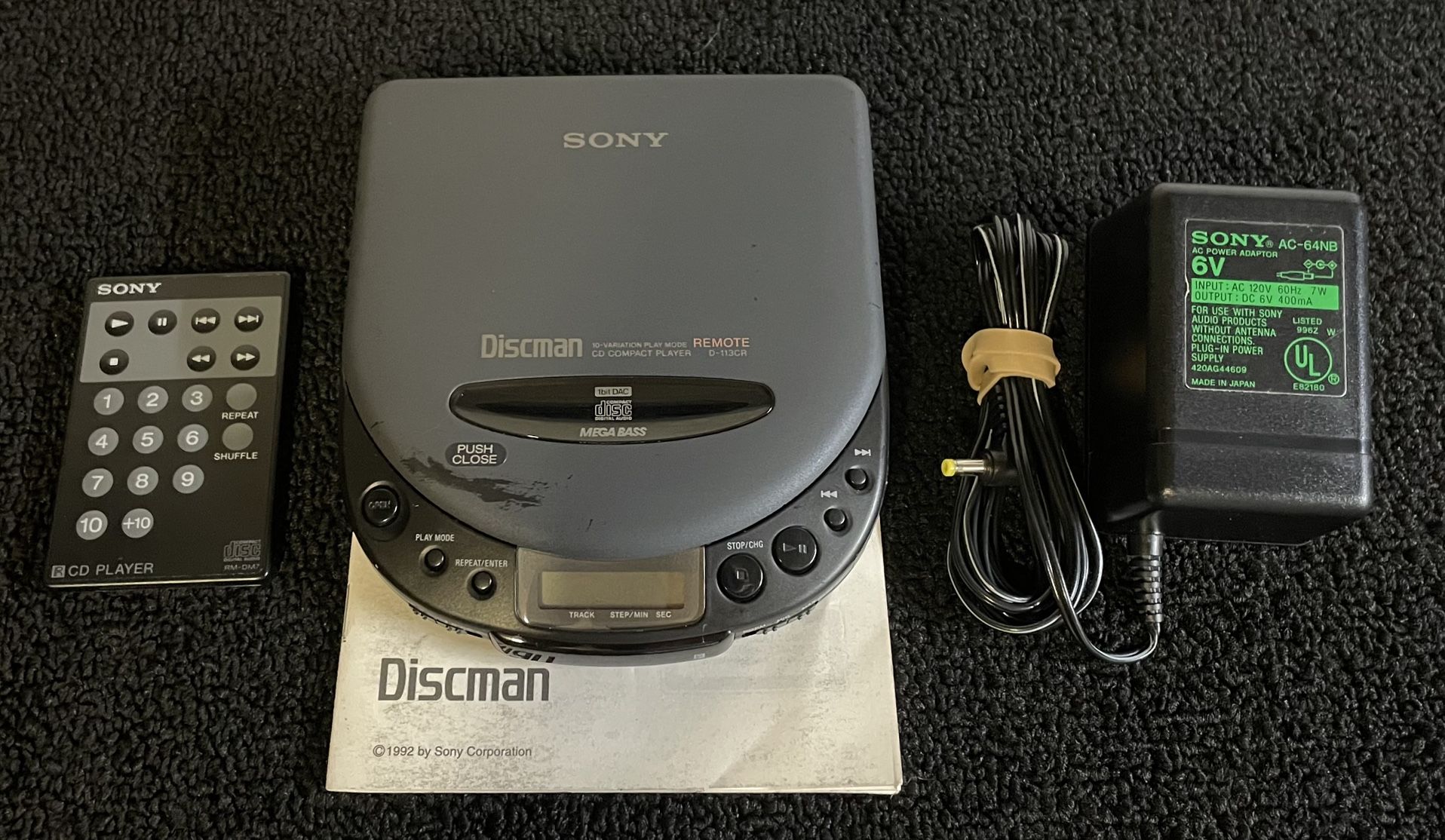 Sony DiscMan With Remote, AC Adapter, And Manual
