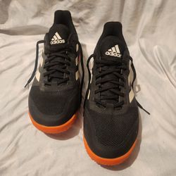 Adidas Stabil Bounce indoor court shoes in a black and white colorway with a solar orange sole.

Worn but good.

Size 12